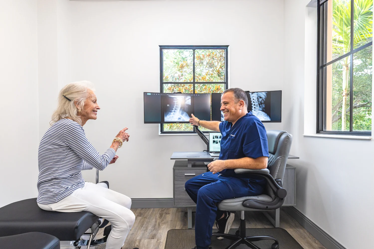Dr. Kleinfeld explaining a spinal X-ray diagnostic scan to a patient, anchoring our Jupiter chiropractic health and wellness blog.