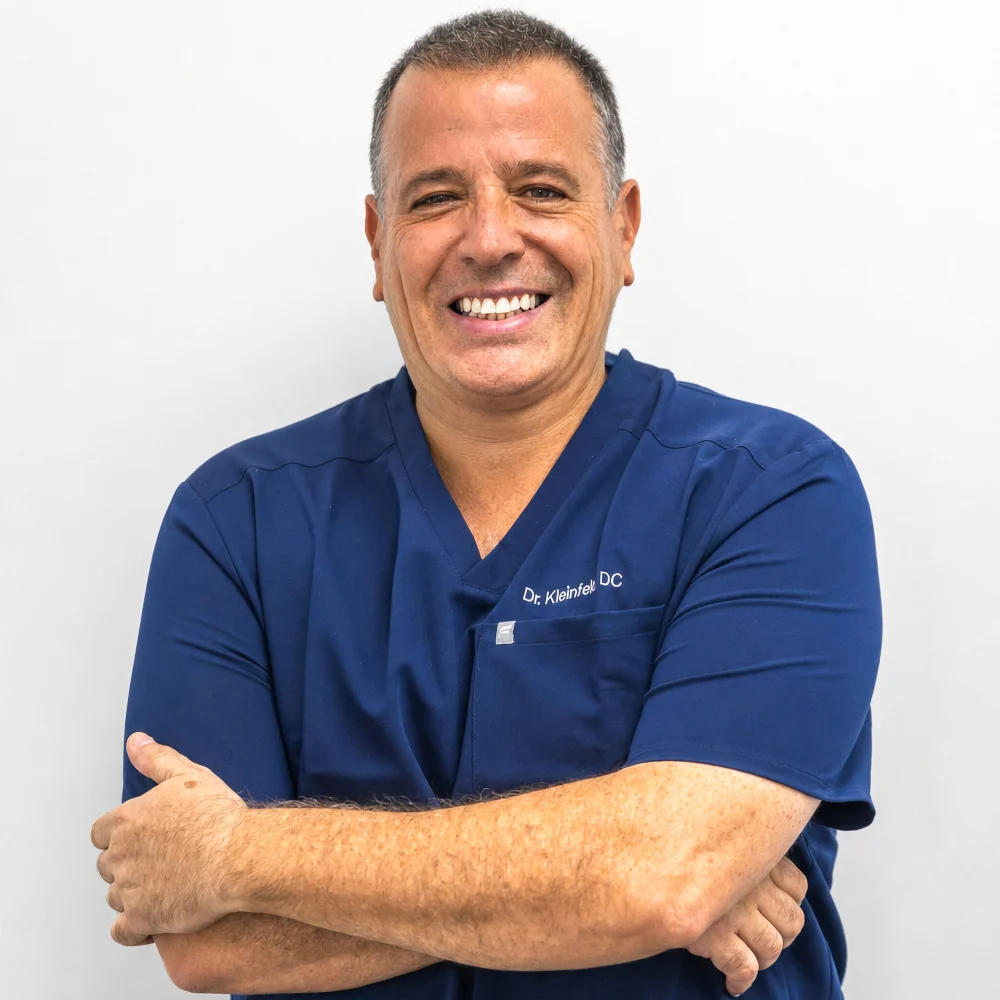 Dr. Kleinfeld A professional headshot of Dr. Kleinfeld, DC, a leading chiropractor at Revive Spine and Wellness in Jupiter, Florida.
