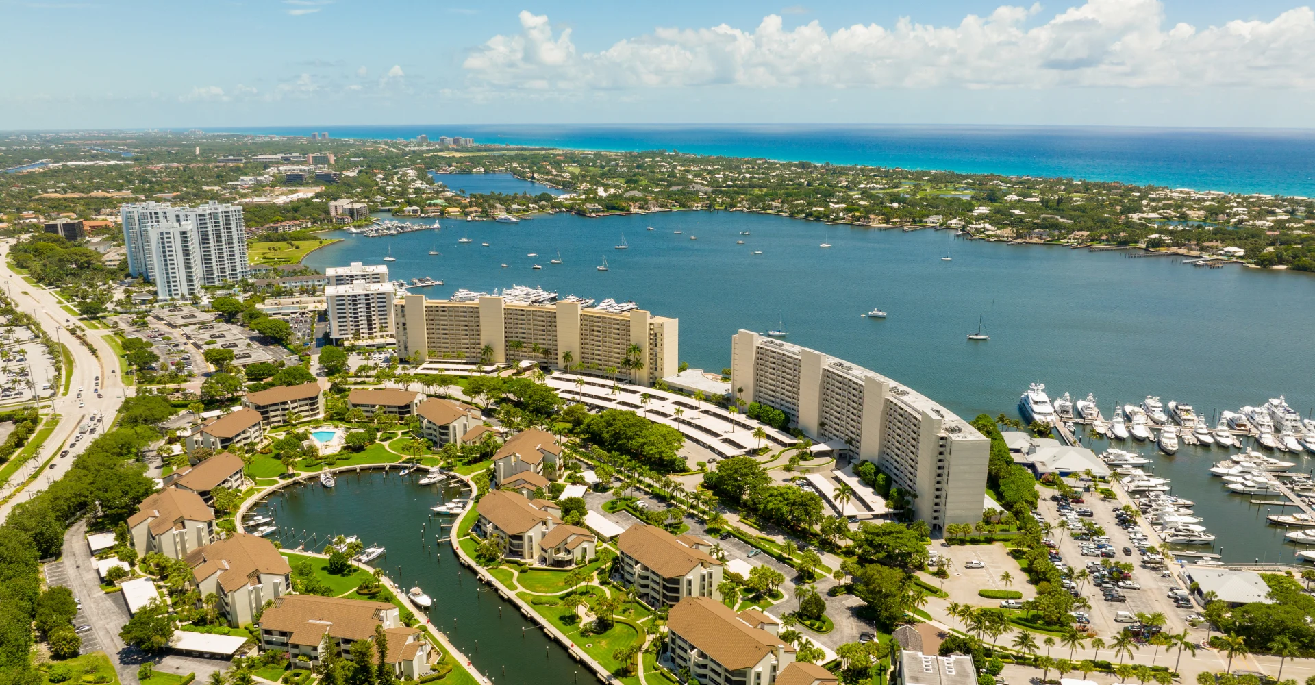 North Palm Beach Aerial A drone landscape shot of the North Palm Beach intracoastal waterway and harbor, representing communities cared for by Dr. Kleinfeld.